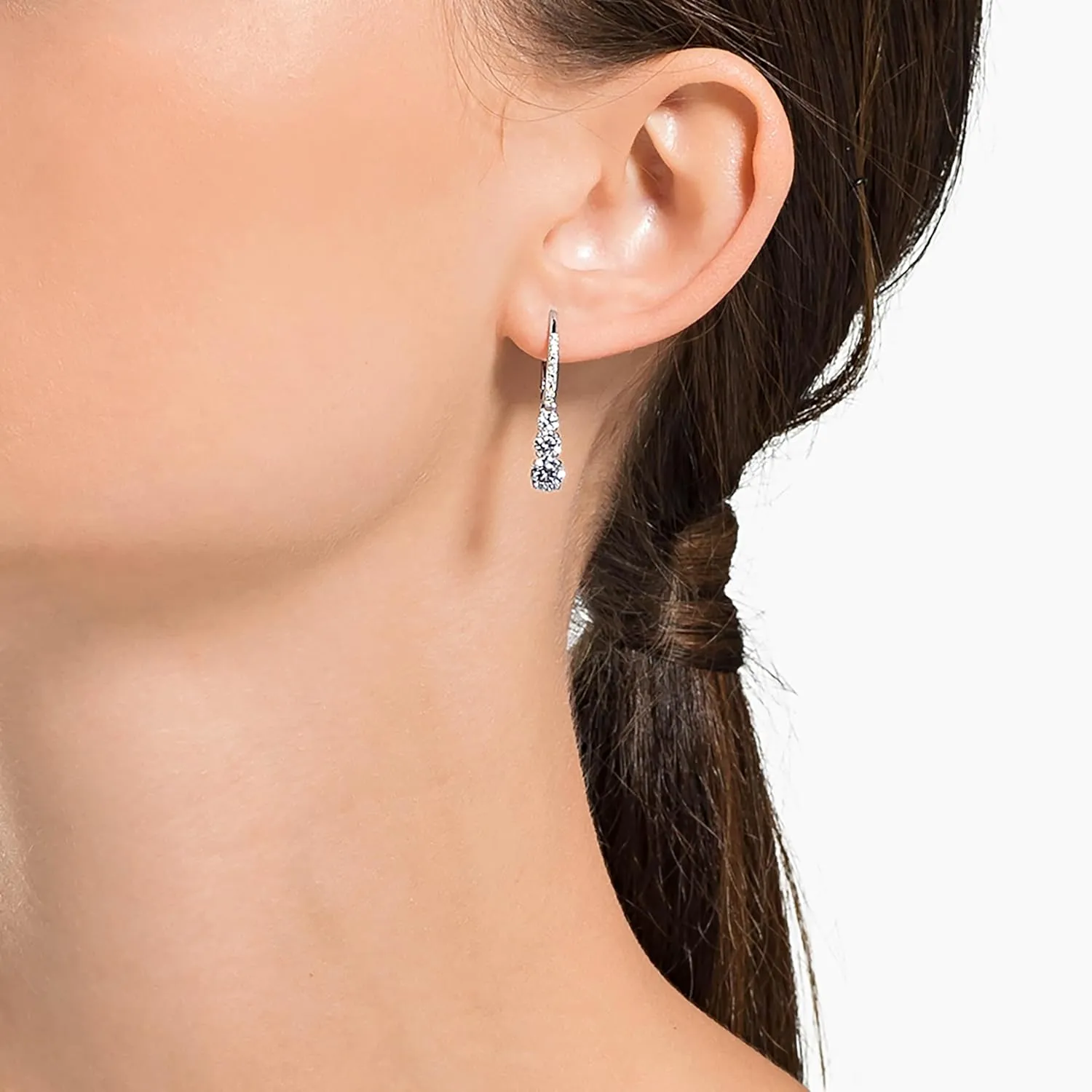 Swarovski drop earrings worn on ear