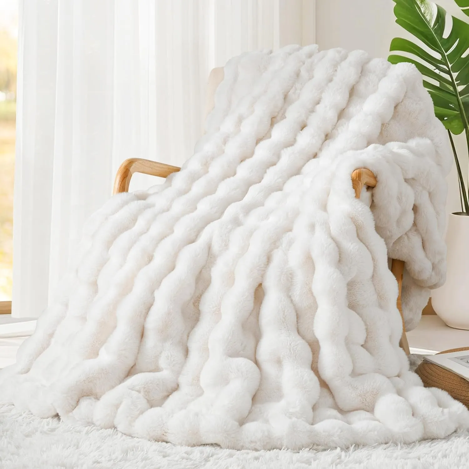 Cream white faux fur throw blanket on chair