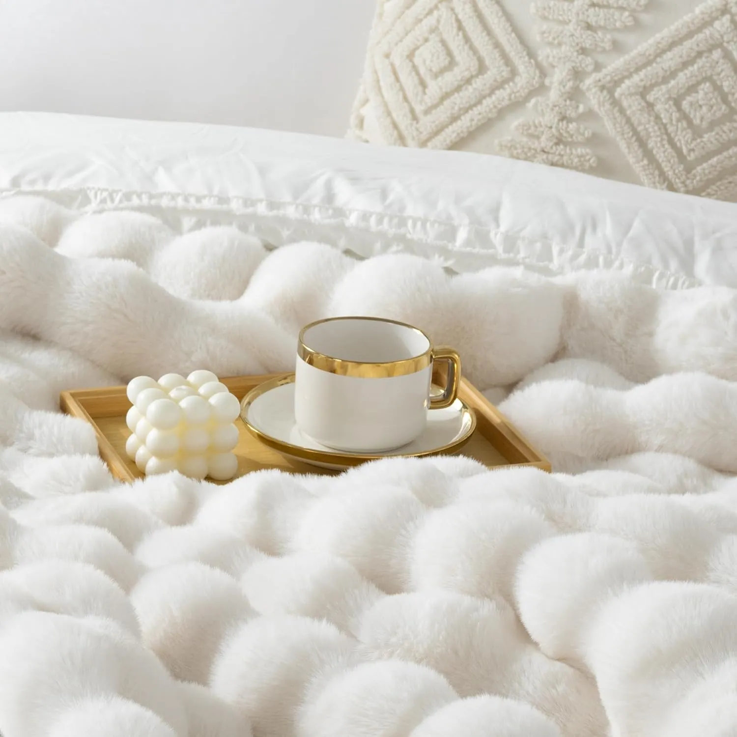 White faux fur blanket with tray and gold cup detail