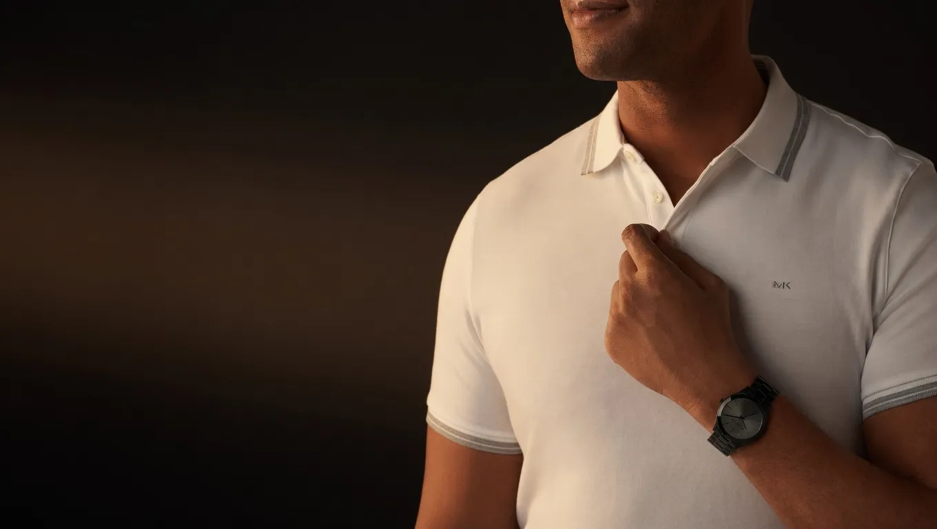 Michael Kors Slim Runway watch worn with a white polo shirt