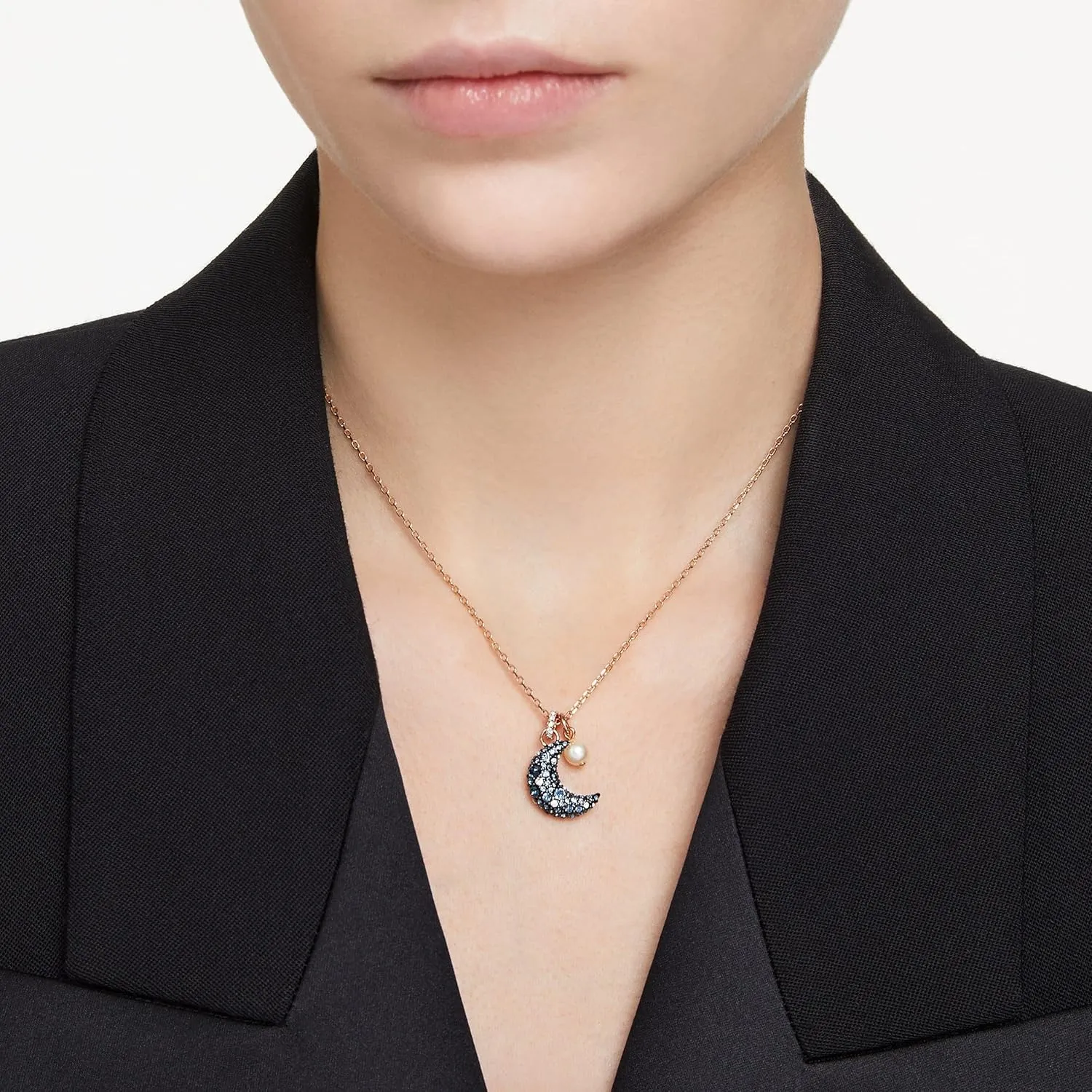 Swarovski Luna crescent moon crystal necklace worn with a black blazer