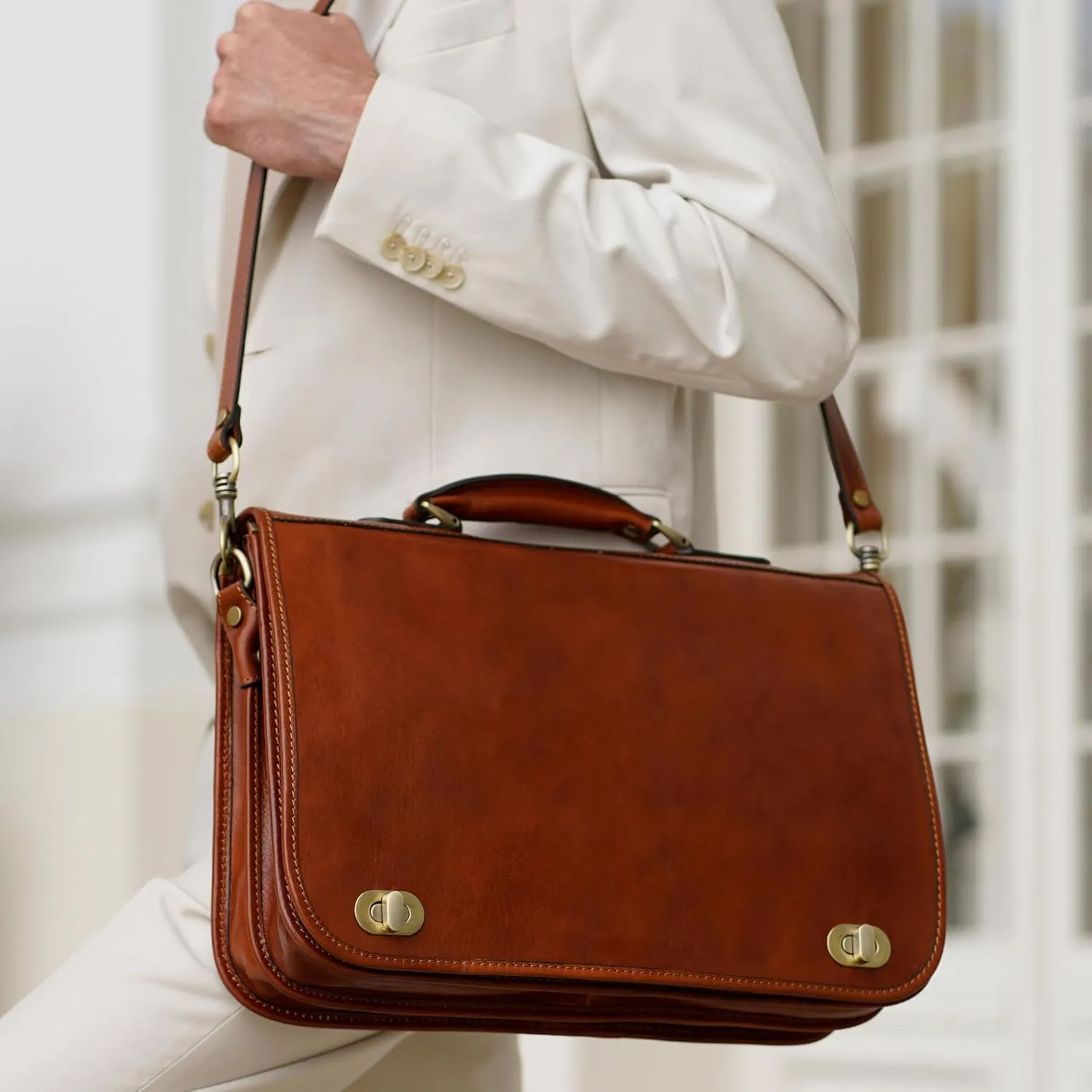 Close view of Time Resistance leather briefcase carried on shoulder
